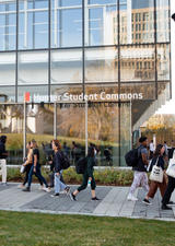 students walking past the Hunter Student Commons